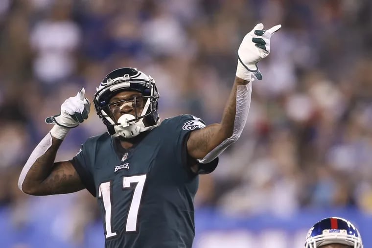 Eagles wide receiver Alshon Jeffery indicates a first-down during the first quarter against New York Giants cornerback Eli Apple on Thursday, October 11, 2018 in East Rutherford, NJ. TIM TAI / Staff Photographer