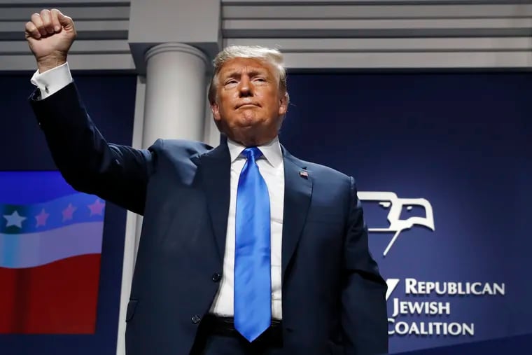 President Donald Trump holds up his fist as he finishes his speech at the Republican Jewish Coalition's annual leadership meeting, Saturday April 6, 2019, in Las Vegas. (AP Photo/Jacquelyn Martin)
