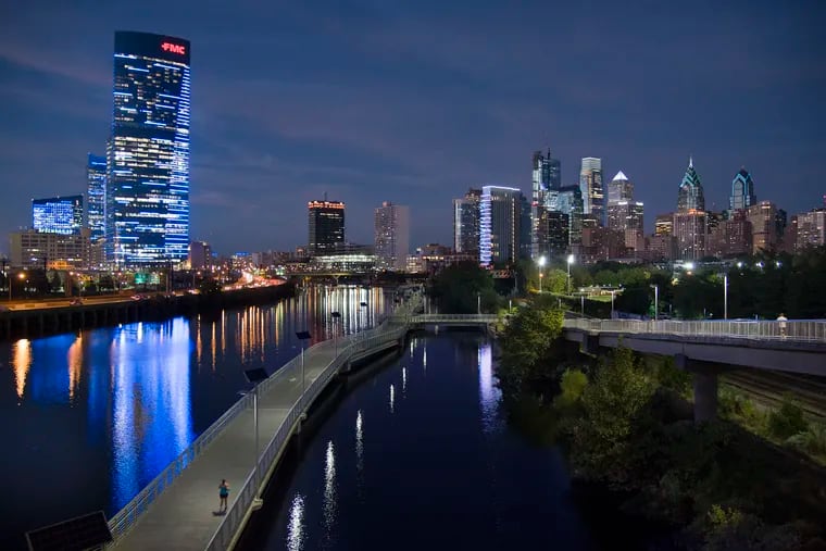 The Philadelphia skyline seen from the South Street Bridge over the Schuylkill River September 26, 2017 includes the still-under-construction Comcast Technology Center and Comcast Center; One and Two Liberty Place; the FMC Tower and Cira Centre South and the Boardwalk section of the Schuylkill River Trail.