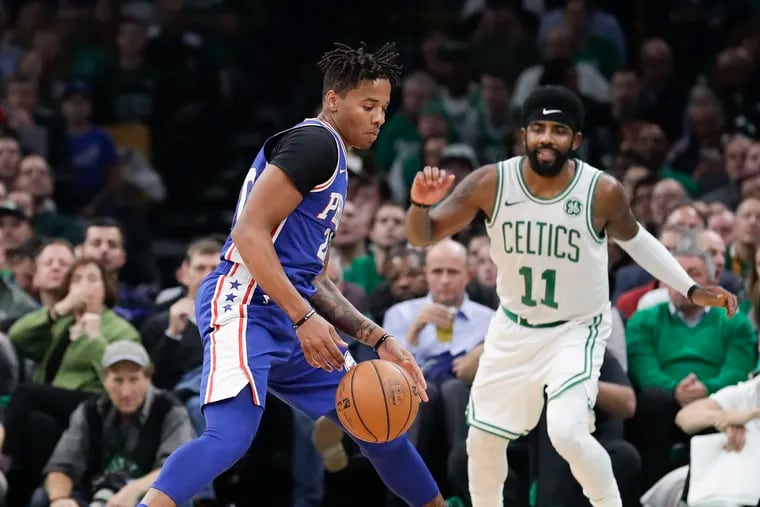 Sixers guard Markelle Fultz steals the basketball past Celtics guard Kyrie Irving.