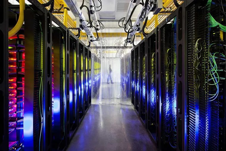 In this undated file photo made available by Google shows the campus-network room at a data center in Council Bluffs, Iowa. With the cooperation of foreign allies, the NSA is potentially gaining access to every email sent or received abroad, or between people abroad, from Google and Yahoo’s email services, as well as anything in Google Docs, Maps or Voice, according to a series of articles in the Washington Post.  (AP Photo/Google, Connie Zhou, File)