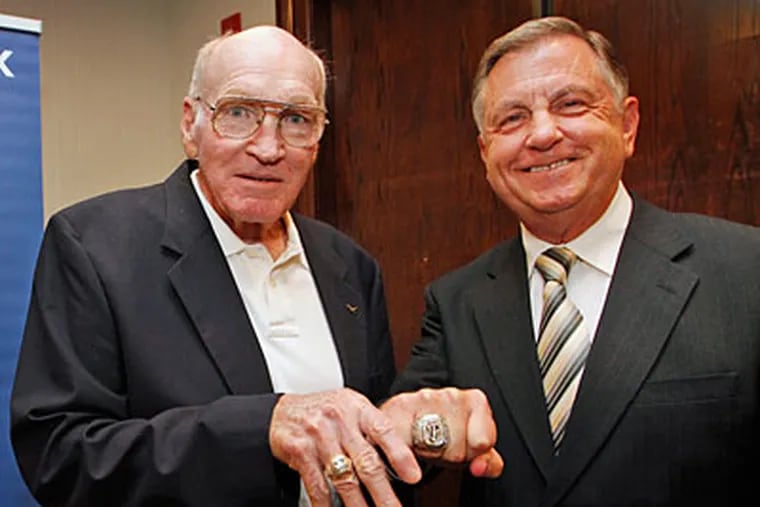 Sports Hall of Fame inductees Maxie Baughan, left, and Dan Baker pose with championship rings. (Alejandro A. Alvarez/Staff Photographer)