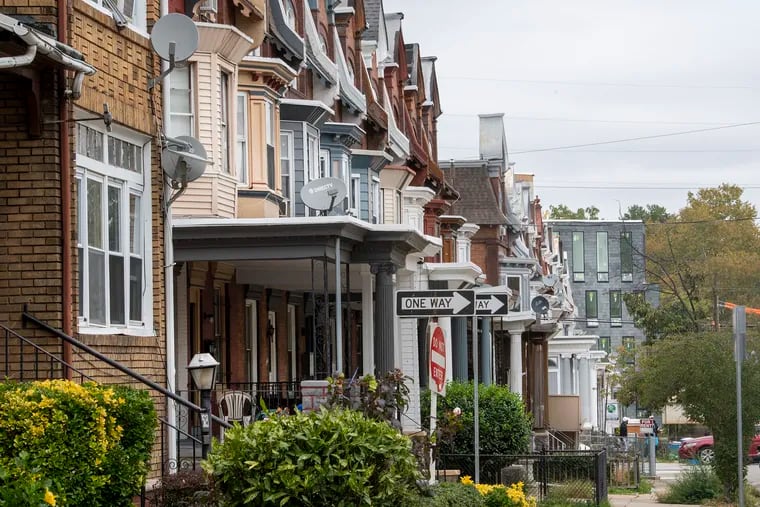 Rowhouses are shown on Springfield Avenue in Southwest Philadelphia. Once a largely Black neighborhood, Cedar Park is undergoing warp-speed gentrification.