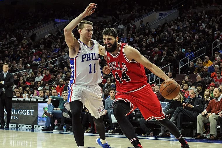 Chicago Bulls forward Nikola Mirotic (44) drives to the net as Philadelphia 76ers guard Nik Stauskas (11) defends during the third quarter of the game at the Wells Fargo Center. The Chicago Bulls won the game 115-111 in overtime.