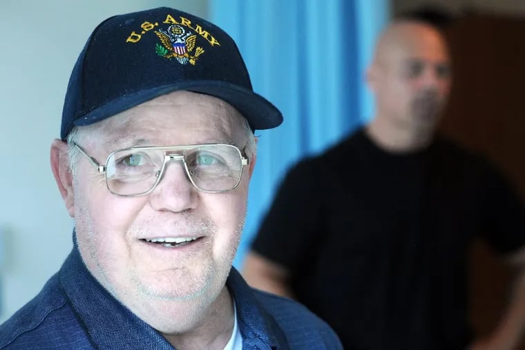 Ken Keene Sr. talks  about living with dementia as his son Ken Jr. stands in the background at the Delaware Valley Veterans Home.