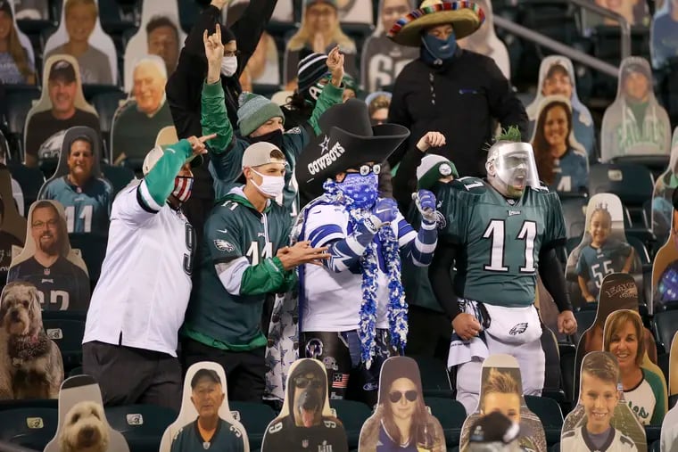A few of the fans at the Linc Sunday night, surrounded in the stands by cutouts.
