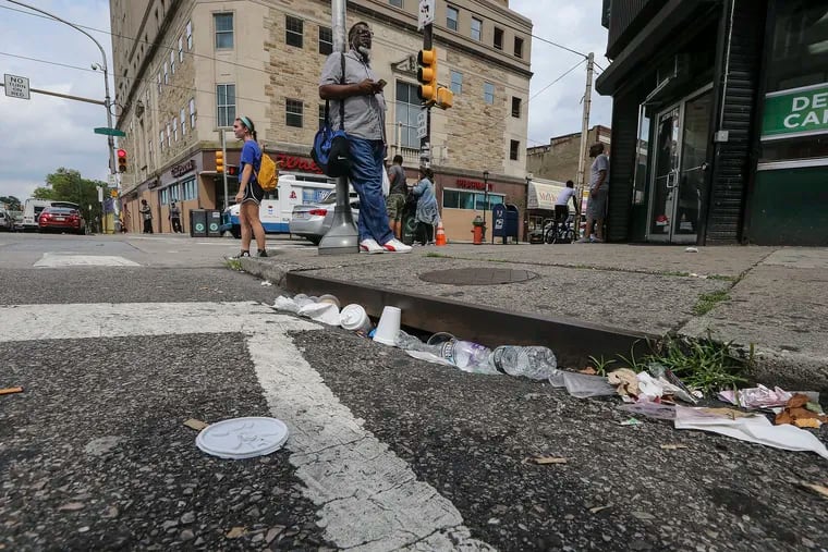 A file photo of trash along the intersection of Chelten and Germantown Avenues in July 2019.