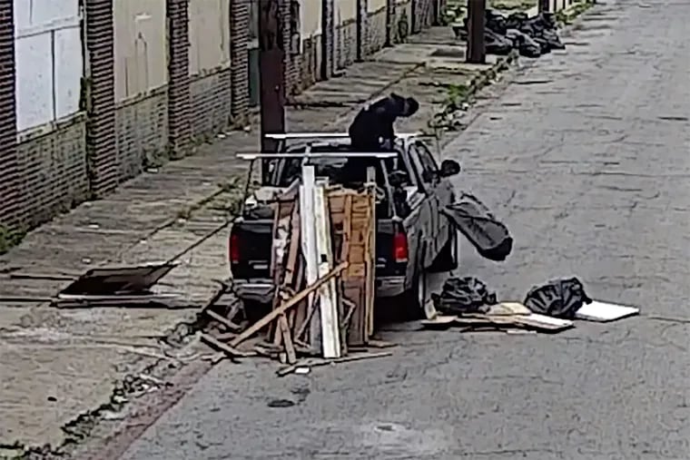 Illegal dumping activity on an unknown date along Coral Street in the Frankford section of Philadelphia, as shown in a video screen capture from a video released by the City of Philadelphia.