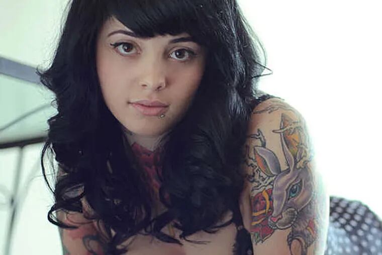 Most, but not all, of the SuicideGirls are adorned with tattoos and piercings . . . and attitude.