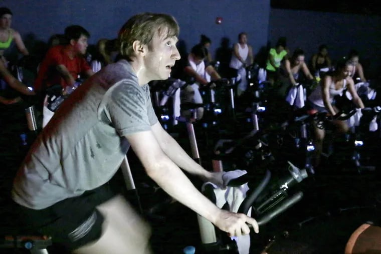 Leonid Spesivtsev spins during a "Method 45" cycling class at Flywheel Sports in Center City Phila. on Aug. 12, 2018.