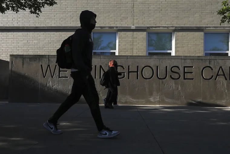 Students arrive at Westinghouse College Prep in Chicago's Humboldt Park neighborhood in May. The school revamped its entire dress code policy during the last school year after discovering that some rules, including restrictions on hair-care items like durags, were causing some students to be admonished more than others.