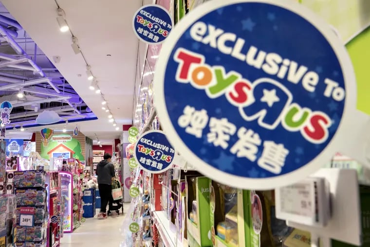 A customer pushes a stroller through a Toys R Us Asia store in Shanghai, China, on Dec. 9.