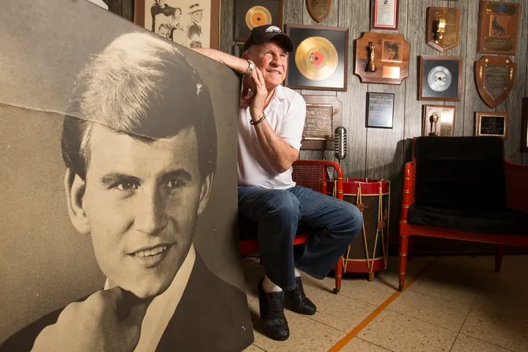 Philadelphia rock legend Bobby Rydell has a book coming out in May.  He is shown in his music room at home on April 20, 2016, with a vintage photo of himself when he was in his twenties.  CHARLES FOX / Staff Photographer