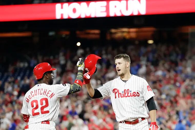 Phillies Andrew McCutchen celebrates his two run third-inning home run with teammate Cole Irvin against the Colorado Rockies on Friday, May 17, 2019 in Philadelphia.