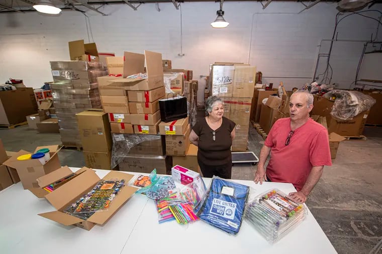 Raelyn Harman and Joe Teodoro are photographed at Total Fulfillment Services Inc., in West Chester, Wednesday, May 19, 2021. Harman and Delco native Teodoro have stepped up to offer storage space for many of the donated teaching supplies her group stockpiles and distributes to needy teachers and students in Southeastern Pennsylvania.