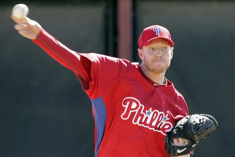 Roy Halladay throws during spring training in February 2010.