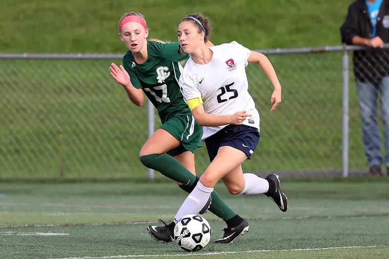 Eastern's Sara Brocious (right) chases the ball against Camden Catholic on Sept. 28.