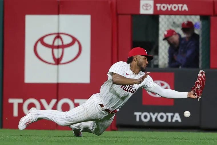 Johan Rojas of the Phillies is unable to catch a double by Jeff McNeil of the Mets in the 8th inning on May 15, 2024 at Citizens Bank Park.