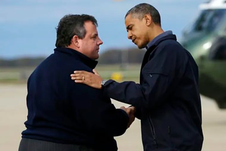 President Barack Obama is greeted by Gov. Chris Christie upon his arrival at Atlantic City International Airport. (AP Photo/Pablo Martinez Monsivais)