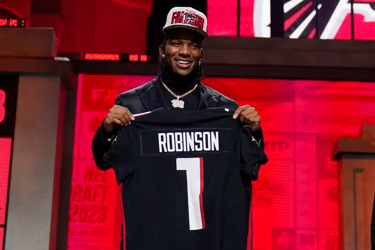 Texas running back Bijan Robinson poses after being chosen by the Atlanta Falcons with the eighth overall pick during the first round of the NFL football draft, Thursday, April 27, 2023, in Kansas City, Mo.