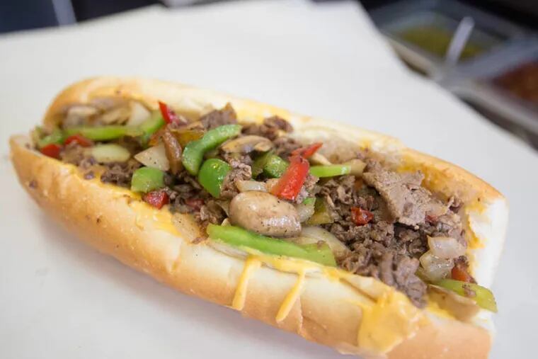 A Sumo Steaks cheesesteak with onions, mushrooms, peppers and whiz cheese. ( Colin Kerrigan / Philly.com )