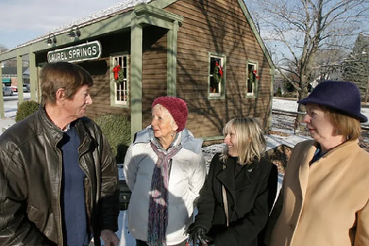 Outside Laurel Springs' historic building known as the Train Station are (from left) Mayor Jack Severson and members of the Laurel Springs Beautification and Historical Society Nancy Sachleben, Sharon Harris, and Pat Tamburrina. (Akira Suwa / Staff Photographer)
