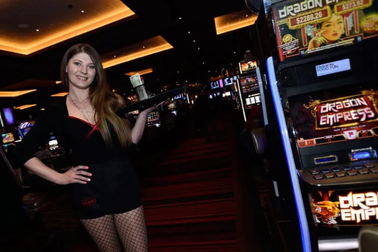 Server Svitlana Tretyak, 29, found work at Maryland Live! outside Baltimore after losing her job at Revel in Atlantic City. She says her tips are better at Maryland Live!, where gamblers have to pay for drinks. (GAIL BURTON)
