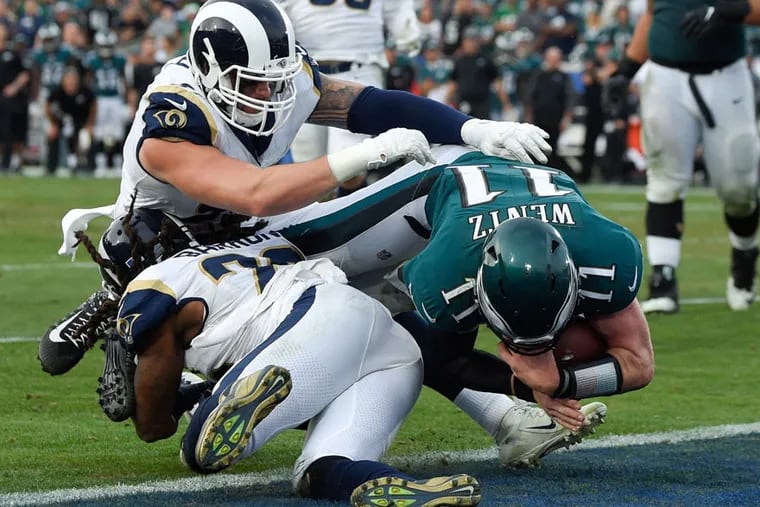 The Eagles have won six in a row against the Rams, including in L.A. in 2017. He's shown here scoring on a QB keeper, in which he tore his ACL. The touchdown was called back because of a penalty, but Wentz remained in the game. Four plays later he threw a touchdown pass. That was his last pass of that season. Nick Foles came in and led the team to the Super Bowl.