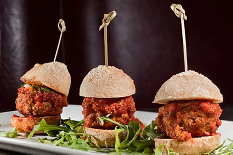 Village Belle chef Lou Campanaro returns to South Philly from more glamorous locales, turning Grandma's meatballs into canape sliders on the bar menu. (DAVID M WARREN / Staff Photographer)