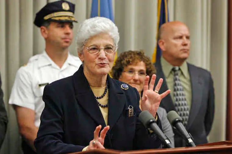 District Attorney Lynne Abraham announces at a news conference yesterday the indictment of 18 individuals for a list of charges, all felonies, including welfare fraud, conspiracy and theft.