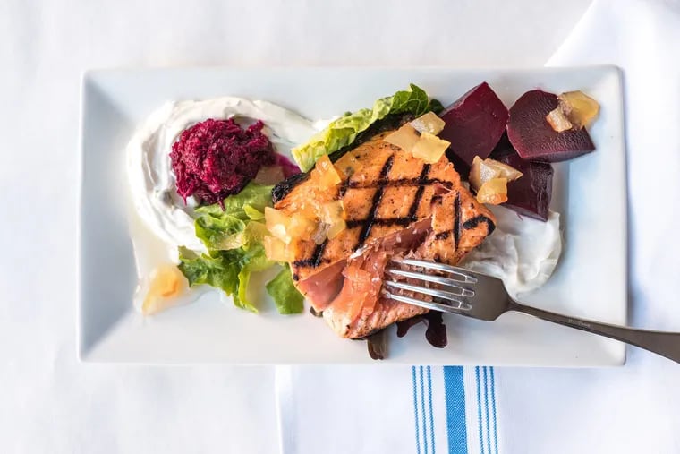 Cured meat, hearty whole-grain bread, pickled vegetables, and smoked fish — like the grilled gravlax pictured here, from Passyunk's Noord — are staples of Nordic cuisine.