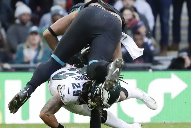 Eagles free safety Avonte Maddox stops Jacksonville Jaguars tight end David Grinnage at Wembley Stadium in London on Sunday, October 28, 2018. YONG KIM / Staff Photographer