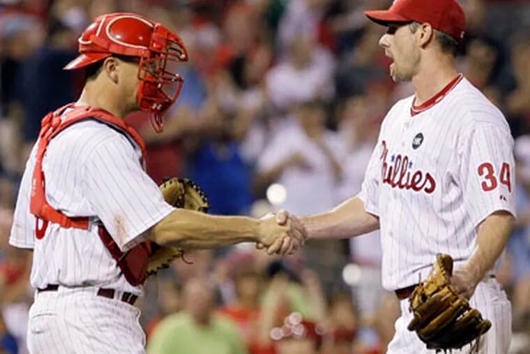 Catcher Paul Bako (left) has caught all four of Cliff Lee's starts with the Phillies.   (AP Photo/Matt Slocum)