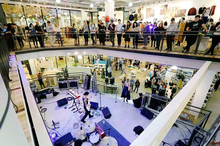 A band plays at the reopening of Urban Outfitters at the King of Prussia Mall. Anthropologie, Free People, and Pizzeria Vetri Square Pie are also there now.