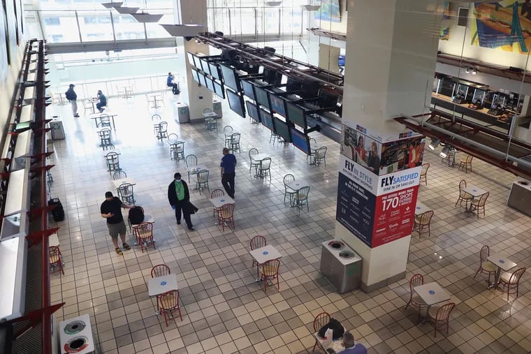 Dining tables are spaced out at Philadelphia International Airport on Tuesday, June 30, 2020. American Airlines plans to increase the number of flights from Philadelphia starting July 7.