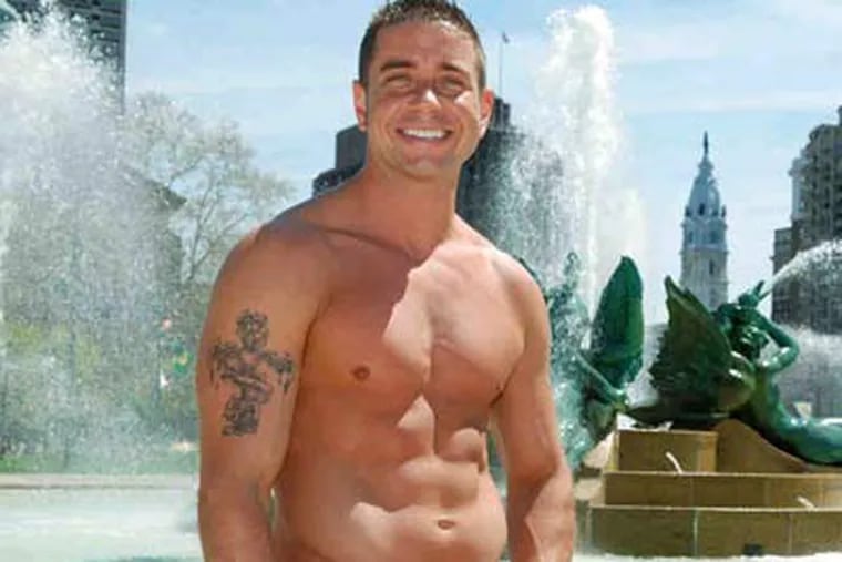 Jack Slivinski, 31, a Philadelphia firefighter as he posed in front of the Logan Circle fountain for a charity calendar.