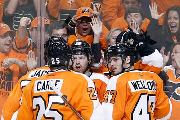 Flyers' Claude Giroux celebrates his first period goal with his teammates against the Pittsburgh Penguins in game six of the Eastern Conference quarterfinals on Sunday, April 22, 2012.  ( Yong Kim / Staff Photographer )