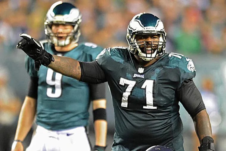 Eagles offensive tackle Jason Peters and quarterback Nick Foles. (Clem Murray/Staff Photographer)