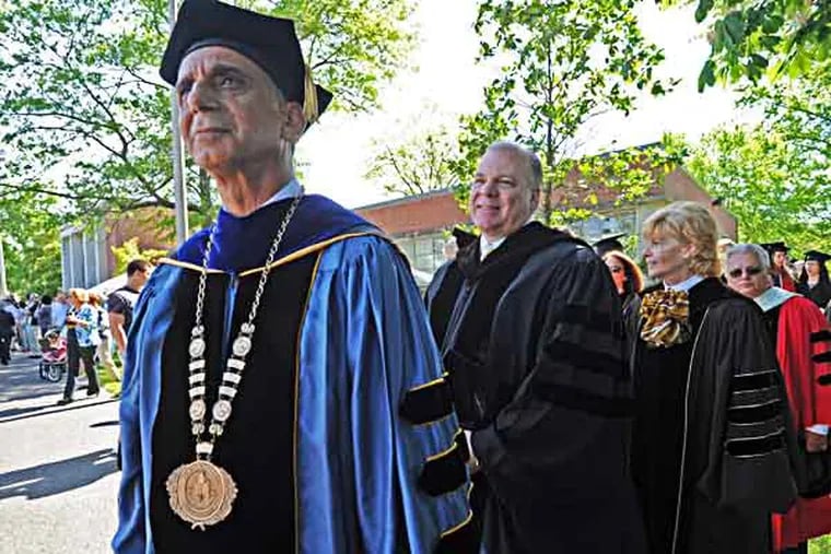 At the Rowan University commencement, NJ State Senate President  Steve Sweeney was the speaker on 5/17/13. Here, he waits with Dr. Ali Houshmand, Rowan president, left; and Chairman of the Board of Trustees Linda Rohrer.  ( APRIL SAUL / Staff )