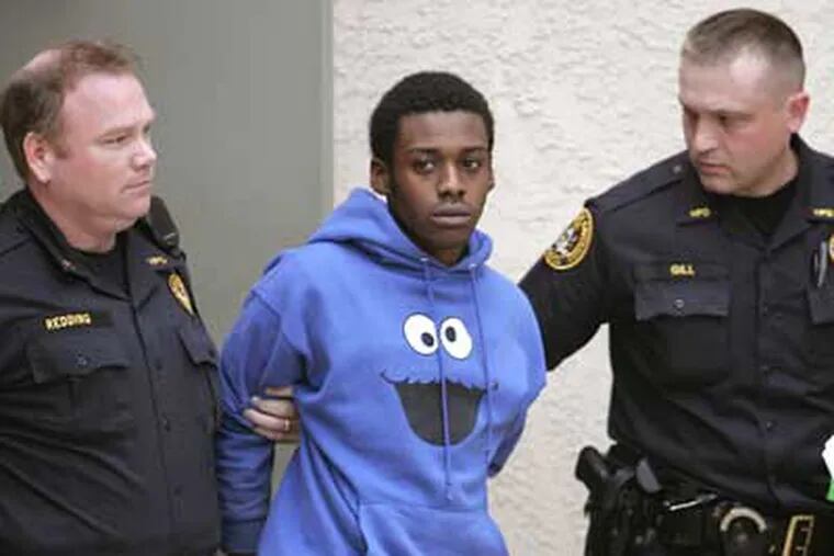 Kenneth Woods is led to his arraignment Thursday morning. (David Swanson / Staff Photographer)