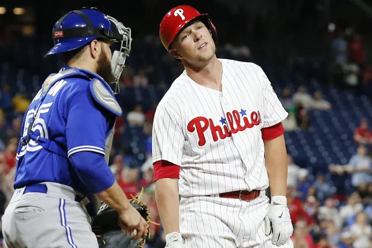 Phillies’ leftfielder Rhys Hoskins reacts to a called strike three in the bottom of the ninth inning of the Phillies’ 6-5 loss to the Blue Jays on Friday.