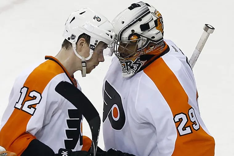 Michael Raffl and Ray Emery celebrate the Flyers' Game 2 victory over the Rangers. (Yong Kim/Staff Photographer)