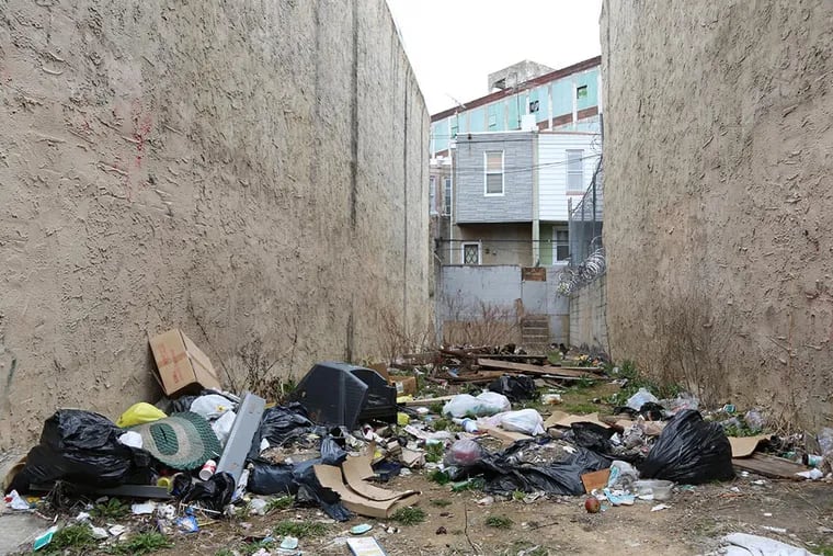 Littering and illegal dumping are major sources of blight in Kensington and other parts of the city. Would more garbage cans alleviate the problem, or just attract more dumpers who trash up the place? (JAMIE MOFFETT)