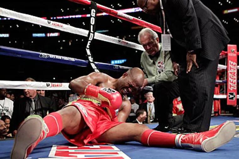 Bernard Hopkins was pushed out of the ring by Chad Dawson in the second round of their match last weekend. (Jae Hong/AP)