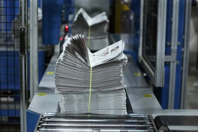 Newspaper bundle comes off the press at the Chicago Tribune.