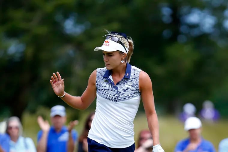 Lexi Thompson responds to applause from fans after the second hole during final round of the LPGA Classic golf tournament, last June in Galloway, N.J.