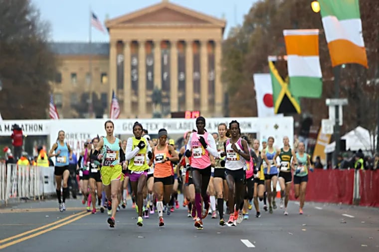 Runners make their way down Benjamin Franklin Parkway during the
Philadelphia Marathon (AP Photo/Joseph Kaczmarek)