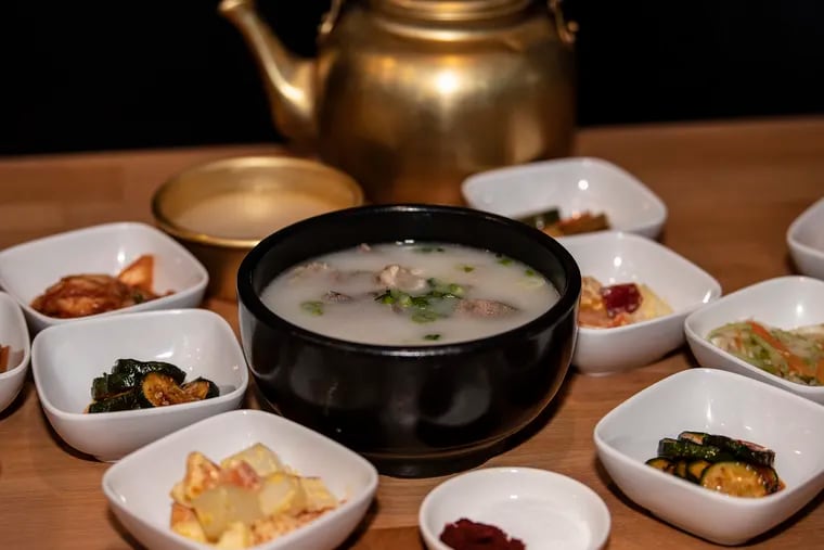 Sullungtang, an ox bone soup, with banchan (side dishes) at Seorabol's location on Spruce Street in Center City.