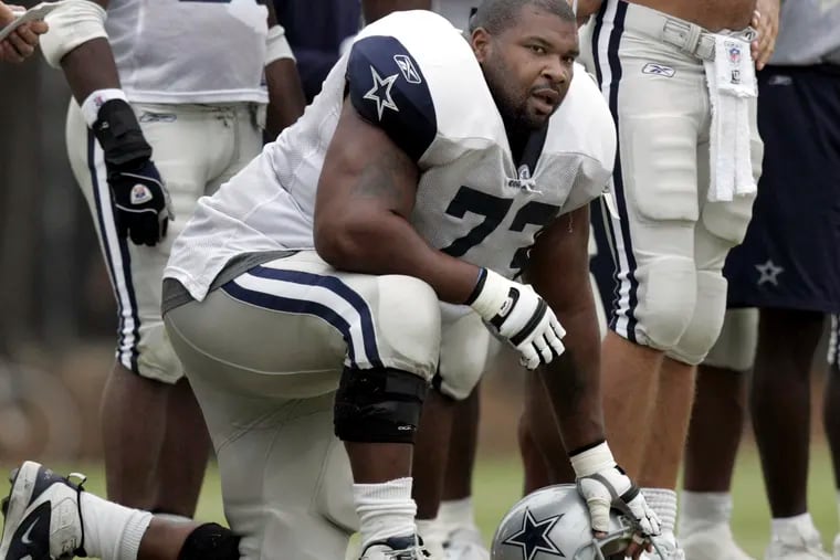 Dallas Cowboys lineman Larry Allen taking a knee during training camp on Aug. 1, 2005, in Oxnard, Calif.