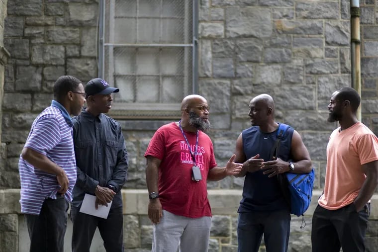 John Pace (left), a former juvenile lifer,   with members of the reentry support group he started in May after being released from prison. From left are  Jeffrey Dean, Vincent Boyd, Charles Brown, Stacey Torrance.